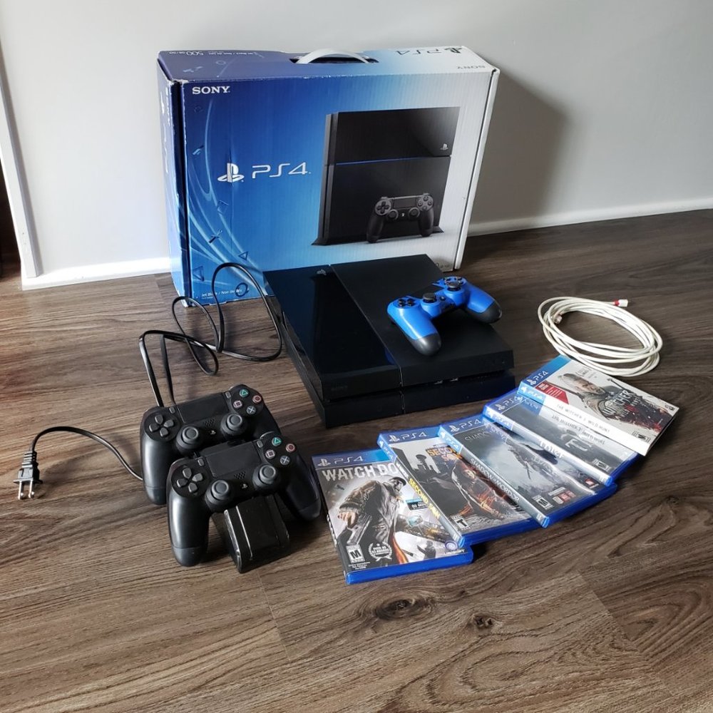 PS4 1TB + 11 games, 3 controllers, wireless charging station